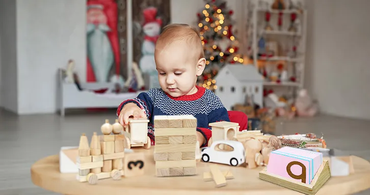 A kid playing with wooden toys on a table.